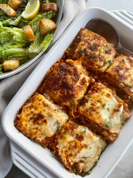 Hearty Beef Lasagna served with a Caesar Salad and Handmade Croutons
