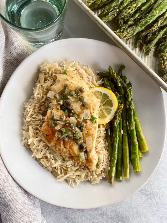 Chicken Piccata served with Asparagus, and Rice Pilaf or Linguine